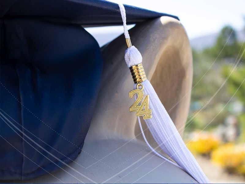Image of a graduation cap with tassel showing 2024
